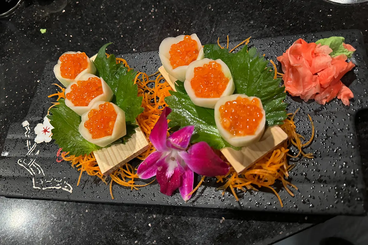 Sushi topped with caviar, decorated with edible flowers at Gyuto Sushi & Ramen，a Japanese Restaurant in Arlington