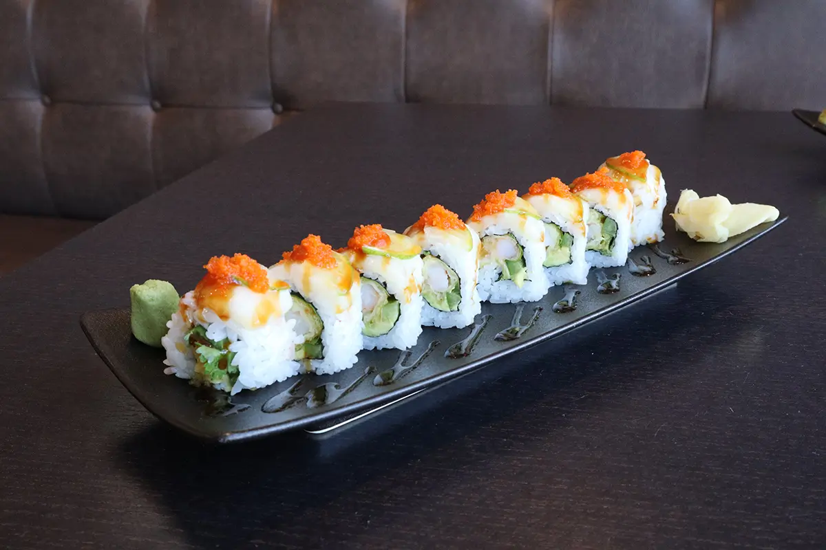 Long - plate sushi roll topped with fish roe at Gyuto Sushi & Ramen，a Japanese Restaurant in Arlington