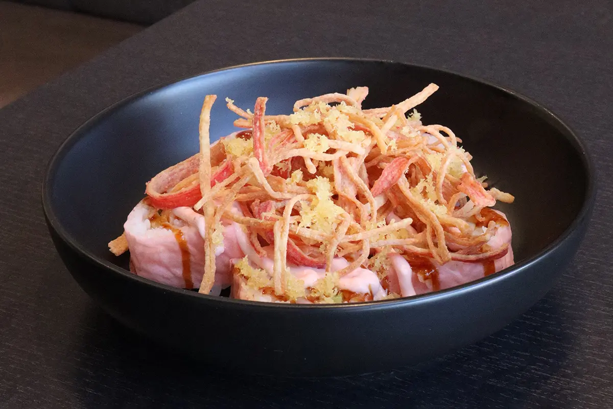Cold noodle salad in a black bowl, with shredded veggies at Gyuto Sushi & Ramen，a Japanese Restaurant in Arlington